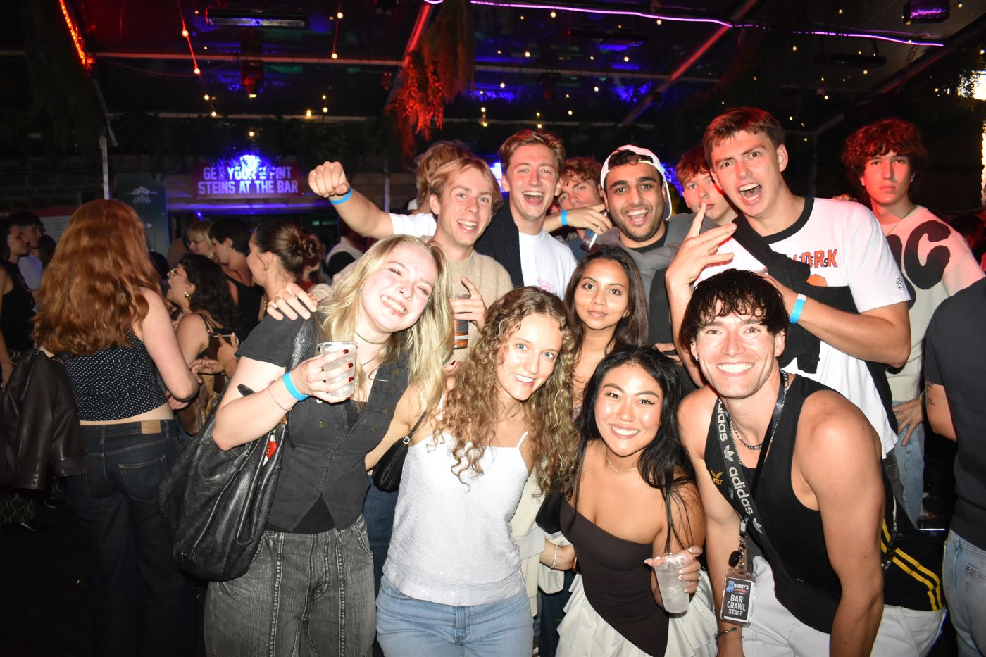 Packed club floor with the hosts