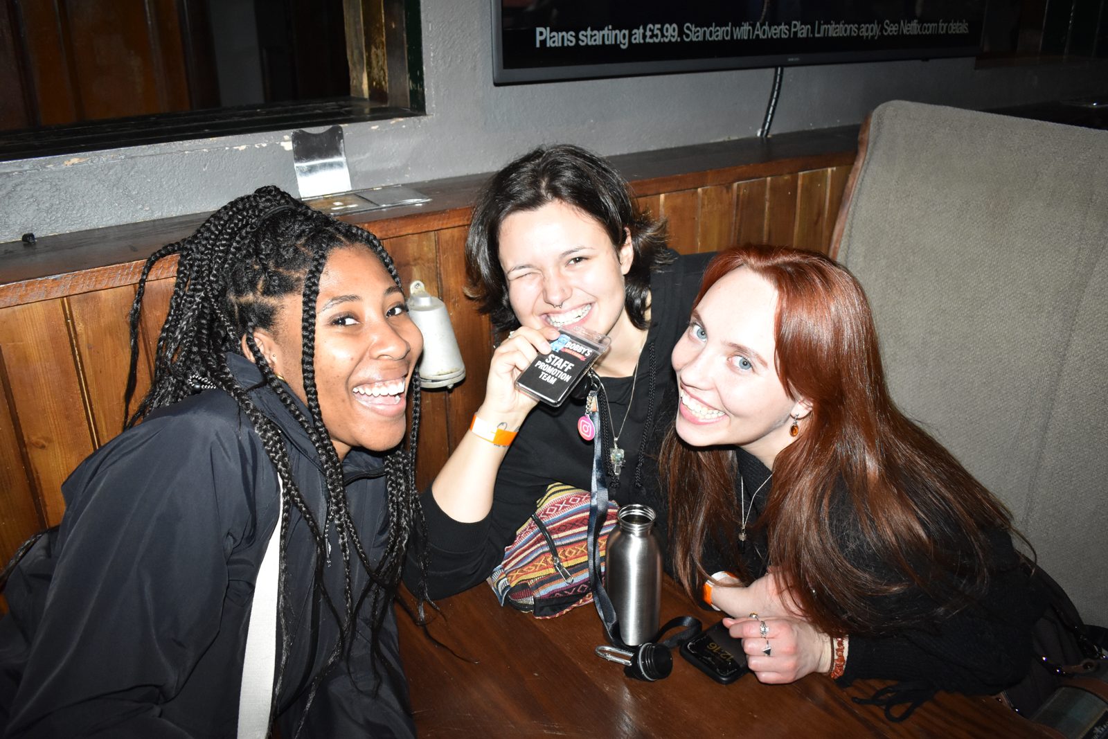 Friends in a pub booth